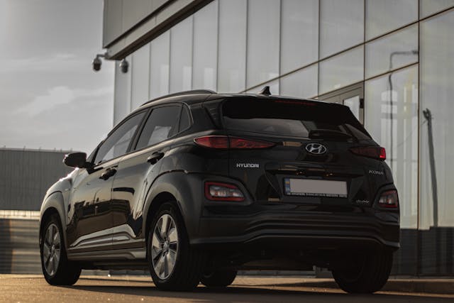 Hyundai Creta Price in Bhubaneswar, Jaipur & 9 More Cities Black Hyundai SUV rear view parked outside glass building